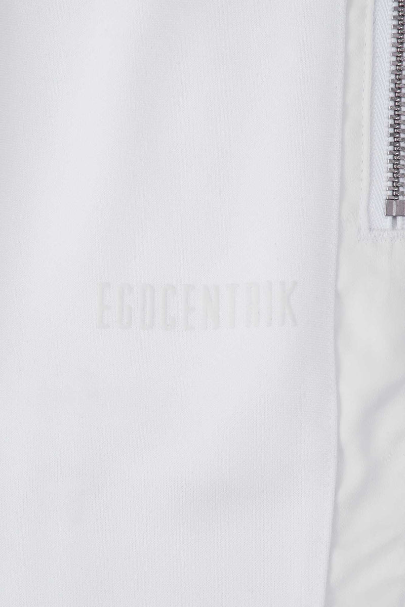 Zoom nom de la collection Egocentrik by Galerie 75 ce pantalon est contrastée de 2 bandes beiges et motifs en transparence sur le long des jambes