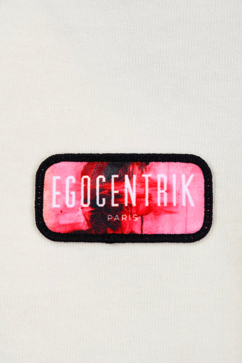 le logo EGOCENTRIK sur le coeur en broderie